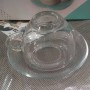 Tasse en verre claire ovale et soucoupe